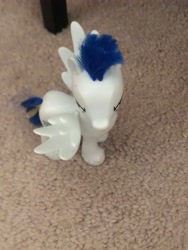 Size: 3024x4032 | Tagged: safe, derpibooru import, soarin', pegasus, pony, angry, bed leg, carpet, cute, front view, hair accessory, hairpin, irl, kind of bird's eye perspective, male, photo, soarinbetes, solo, spread wings, stallion, story included, toy, wings