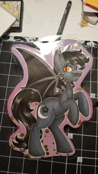 Size: 2988x5312 | Tagged: safe, artist:inkkeystudios, derpibooru import, oc, oc only, bat pony, pony, badge, fangs, looking at you, photo, rearing, smiling, solo, spread wings, traditional art, wings