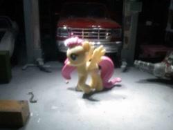 Size: 756x569 | Tagged: safe, derpibooru import, fluttershy, pony, blind bag fluttershy, car lift, diorama, engine, ford f-150, garage, shop, solo, toy, transmission