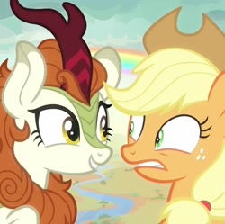 Size: 1086x1080 | Tagged: safe, derpibooru import, screencap, applejack, autumn blaze, earth pony, kirin, pony, season 8, sounds of silence, spoiler:s08, a kirin tale, cropped, duo, duo female, eye contact, female, looking at each other, looking at someone, mare, rainbow, singing, uneasy
