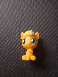 Size: 3120x4160 | Tagged: safe, derpibooru import, photographer:hollyn, applejack, earth pony, pony, baby, baby pony, babyjack, foal, photo, solo, toy, younger