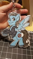 Size: 2988x5312 | Tagged: safe, artist:inkkeystudios, derpibooru import, pegasus, pony, badge, clothes, colored wings, colored wingtips, jacket, looking at you, photo, smiling, solo, spread wings, traditional art, two toned wings, wings