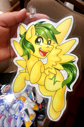 Size: 677x1025 | Tagged: safe, artist:inkkeystudios, derpibooru import, oc, oc only, pegasus, pony, badge, eye clipping through hair, flying, looking at you, open mouth, open smile, photo, smiling, solo, spread wings, traditional art, wings