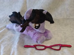 Size: 4096x3072 | Tagged: safe, artist:bluedragonflyplush, derpibooru import, pony, unicorn, beanie (plushie), brendon urie, clothes, commission, glasses, hoodie, horn, irl, lying down, male, panic! at the disco, photo, plushie, ponified, prone, shirt, solo, species swap, stallion, t-shirt