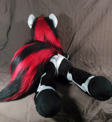 Size: 3006x3286 | Tagged: safe, artist:doctorkoda, derpibooru import, oc, oc only, oc:blackjack, unicorn, fallout equestria, fallout equestria: project horizons, bell, colalr, female, horn, irl, lying down, photo, plushie, prone, solo