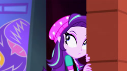 Size: 3072x1727 | Tagged: safe, derpibooru import, screencap, starlight glimmer, human, equestria girls, mirror magic, spoiler:eqg specials, beanie, breasts, canterlot mall, cinema, female, frown, hat, solo