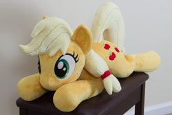 Size: 4178x2786 | Tagged: safe, artist:azgchip, derpibooru import, applejack, earth pony, pony, cute, female, freckles, hatless, lying down, mare, missing accessory, photo, plushie, prone, solo, sploot