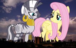 Size: 1651x1056 | Tagged: safe, artist:chezne, artist:shutterflyyay, derpibooru import, edit, editor:jaredking779, fluttershy, zecora, pegasus, pony, zebra, duo, ear piercing, earring, female, giant pony, giantess, highrise ponies, irl, jewelry, kenya, leg rings, macro, mare, nairobi, neck rings, photo, piercing, ponies in real life, story included