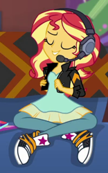 Size: 267x429 | Tagged: safe, derpibooru import, screencap, sunset shimmer, human, better together, equestria girls, game stream, clothes, cropped, dress, gamer sunset, headphones, jacket, leather, leather jacket, pants, sofa, solo, sunset's apartment, trainers