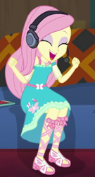 Size: 281x520 | Tagged: safe, derpibooru import, screencap, fluttershy, human, better together, equestria girls, game stream, clothes, cropped, cute, dress, excited, eyeshadow, fluttershy boho dress, gamer fluttershy, happy, headphones, makeup, pink eyeshadow, shyabetes, sofa, solo, sunset's apartment