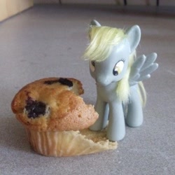 Size: 1920x1922 | Tagged: safe, derpibooru import, derpy hooves, pegasus, pony, eating, food, irl, muffin, photo, solo, toy