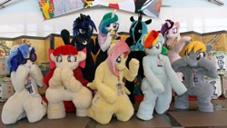 Size: 1200x675 | Tagged: safe, derpibooru import, apple bloom, derpy hooves, dj pon-3, fluttershy, princess cadance, princess celestia, princess luna, queen chrysalis, rainbow dash, vinyl scratch, 2017, badge, cape, clothes, female, fursuit, glasses, group photo, indoors, irl, kneeling, photo, ponysuit, royal sisters, siblings, sisters