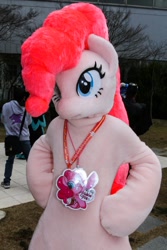 Size: 600x900 | Tagged: safe, derpibooru import, pinkie pie, 2018, badge, fursuit, hooves on hips, irl, outdoors, photo, ponysuit, solo focus