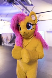 Size: 600x900 | Tagged: safe, artist:atalonthedeer, derpibooru import, fluttershy, pony, 2022, eurofurence, fursuit, irl, photo, ponysuit, solo