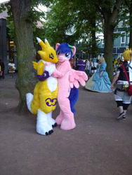 Size: 480x640 | Tagged: safe, artist:atalonthedeer, derpibooru import, firefly, human, g1, 2012, connichi, duo focus, fursuit, irl, irl human, outdoors, photo, pokémon, ponysuit, solo