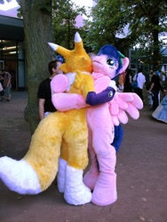 Size: 480x640 | Tagged: safe, artist:atalonthedeer, derpibooru import, firefly, human, g1, 2012, connichi, duo focus, fursuit, irl, irl human, outdoors, photo, pokémon, ponysuit, solo