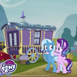 Size: 1080x1080 | Tagged: safe, derpibooru import, starlight glimmer, trixie, pony, unicorn, g4, bipedal, duo, duo female, female, gameloft, horn, looking at each other, looking at someone, mare, my little pony logo, trixie's wagon, wagon