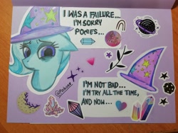 Size: 4160x3120 | Tagged: safe, artist:mashee, derpibooru import, trixie, pony, unicorn, g4, card, horn, looking at you, looking down, photo, purple background, sad, simple background, stars, sticker, traditional art, trixie day