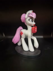 Size: 3000x4000 | Tagged: source needed, safe, artist:draconis taaldis, derpibooru import, nurse redheart, earth pony, pony, g4, female, figurine, hat, mare, medkit, mouth hold, photo, solo