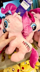 Size: 1079x1920 | Tagged: safe, derpibooru import, pinkie pie, earth pony, human, pony, g4, bootleg, female, implied vietnam, indoors, irl, irl human, mare, photo, plushie, seems legit, vietnamese