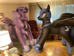 Size: 3264x2448 | Tagged: safe, artist:tbolt, derpibooru import, nightmare moon, princess luna, inflatable pony, pony, g4, armchair, carpet, chair, duo, duo female, female, framed picture, indoors, inflatable, inflatable alicorn, irl, lamp, mare, nightmare moon armor, opaque inflatable, peytral, photo, purple coat, seams, standing, window, wrinkles