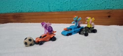 Size: 4160x1920 | Tagged: safe, artist:tom artista, derpibooru import, fluttershy, rainbow dash, twilight sparkle, twilight sparkle (alicorn), alicorn, pegasus, pony, g4, ball, car, crossover, duo, duo female, female, hot wheels, indoors, kinder egg, quad bike, rocket league, tank (vehicle), toy