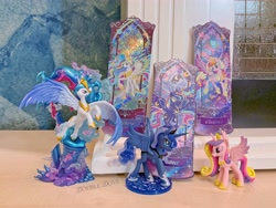 Size: 4380x3285 | Tagged: safe, derpibooru import, princess cadance, princess celestia, princess luna, pony, g4, belly, concave belly, figure, funko, irl, kayou, kotobukiya, large wings, merchandise, music notes, official, photo, rainbow power, rainbow power-ified, raised hoof, raised leg, search fun, side view, slender, spread wings, statue, thin, ticket, toy, wings