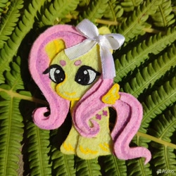 Size: 960x960 | Tagged: safe, artist:sofia metropolskaya, derpibooru import, fluttershy, pegasus, g4, chibi, craft, cute, felt, felting, handmade, looking away, photo, ribbon, shyabetes, smiling, standing