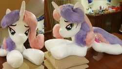 Size: 4032x2268 | Tagged: safe, artist:ponimalion, derpibooru import, sweetie belle, pony, unicorn, g4, bedroom eyes, eyeshadow, female, horn, indoors, irl, lidded eyes, life size, makeup, mare, photo, pillow, plushie, smiling, tail