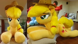 Size: 4032x2268 | Tagged: safe, artist:ponimalion, derpibooru import, applejack, pony, g4, bedroom eyes, female, indoors, irl, lidded eyes, life size, mare, photo, pillow, plushie, smiling, tail