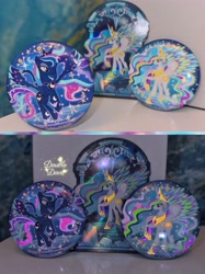 Size: 3442x4590 | Tagged: safe, derpibooru import, princess celestia, princess luna, g4, badge, card, crystal, glow in the dark, irl, merchandise, official, photo, rainbow power, rainbow power-ified, raised hoof, raised leg, spread wings, stained glass, wings