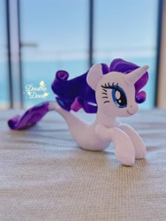 Size: 3024x4032 | Tagged: artist needed, safe, derpibooru import, rarity, seapony (g4), unicorn, g4, bedroom, horn, indoors, irl, ocean, photo, plushie, pony plushie, seaponified, seapony rarity, side view, solo, species swap, water