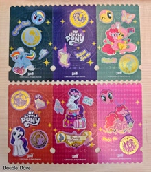 Size: 4273x4853 | Tagged: safe, derpibooru import, angel bunny, fluttershy, pinkie pie, rainbow dash, rarity, twilight sparkle, pony, g4, card, diamond, double dove, duo, duo female, element of loyalty, elements of harmony, female, front view, grand galloping gala, head shot, irl, kayou, looking at you, looking back, luggage, magic, magic aura, merchandise, official, one eye closed, open mouth, open smile, photo, selfie, side view, sitting, smiling, spread wings, stars, sticker, sunglasses, sunglasses on head, text, unamused, wings, wink, winking at you