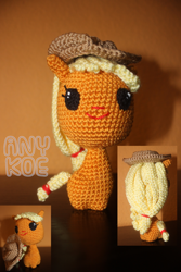 Size: 620x930 | Tagged: safe, artist:anykoe, derpibooru import, applejack, earth pony, amigurumi, crochet, cute, description, female, handmade, hat, photography, plushie, smiling, solo, traditional art, watermark, wool