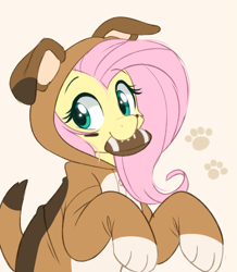 Size: 743x853 | Tagged: safe, alternate version, artist:higglytownhero, derpibooru import, fluttershy, pegasus, pony, american football, beautiful, clothes, costume, cute, dog costume, female, flutterdog, halfbody, irl, kigurumi, looking at you, mouth hold, onesie, paws, photo, pretty, shyabetes, simple background, solo, sports