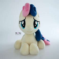 Size: 1600x1601 | Tagged: safe, artist:meplushyou, derpibooru import, bon bon, sweetie drops, earth pony, pony, g4, female, irl, looking at you, lying down, photo, plushie, simple background, solo, white background