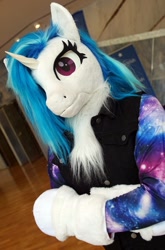 Size: 1012x1536 | Tagged: safe, artist:essorille, derpibooru import, dj pon-3, vinyl scratch, unicorn, clothes, crossed arms, fursuit, galacon 2022, irl, looking at you, photo, ponysuit, solo