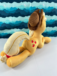 Size: 2244x2992 | Tagged: safe, derpibooru import, applejack, earth pony, original species, pony, applebutt, butt, irl, lying down, photo, plot, plush pony, plushie, prone, rear view, sploot