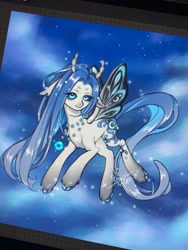 Size: 1536x2048 | Tagged: safe, artist:periwinki3, derpibooru import, oc, oc only, oc:reverie (periwinki3), butterfly, hybrid, pony, blue eyes, blue mane, blue tail, butterfly pony, butterfly pony oc, chest fluff, cloud, coat markings, colored eyebrows, colored hooves, colored horns, concave belly, ears, eye clipping through hair, facial markings, female, floppy ears, flying, gradient legs, horns, in air, jewelry, long mane, long tail, looking at you, mare, necklace, night, pony oc, procreate app, shiny hoof, shiny mane, shiny tail, signature, sky background, smiling, smiling at you, snip (coat marking), solo, sparkles, stars, straight mane, straight tail, tail, torn ear, unshorn fetlocks, white coat, wingding eyes