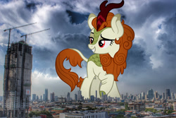 Size: 1599x1066 | Tagged: safe, artist:aeonkrow, derpibooru import, edit, editor:jaredking779, autumn blaze, kirin, g4, attack on pony, bangkok, cloven hooves, eyebrows, female, giant pony, giantess, highrise ponies, irl, lidded eyes, macro, photo, ponies in real life, raised eyebrow, raised hoof, raised leg, red eyes, smiling, solo, story included, thailand