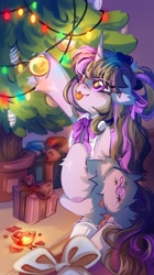 Size: 1432x2560 | Tagged: safe, artist:vanilla-chan, derpibooru import, octavia melody, pony, unicorn, g4, bipedal, christmas, christmas lights, christmas tree, cute, ears, eye clipping through hair, eyebrows, eyebrows visible through hair, female, floppy ears, fluffy, holiday, hoof hold, horn, indoors, looking up, mare, present, race swap, signature, solo, tavibetes, tongue, tongue out, tree