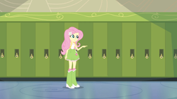 Size: 1280x720 | Tagged: safe, derpibooru import, screencap, fluttershy, equestria girls, g4, backpack, boots, canterlot high, clothes, lockers, my little pony equestria girls, pointing, polka dot socks, shoes, socks, solo