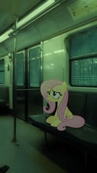 Size: 564x1002 | Tagged: safe, artist:hionazzz, derpibooru import, part of a set, fluttershy, pegasus, pony, g4, background human, bags under eyes, bench, depressed, green background, irl, looking up, photo, photography, public transportation, real life background, simple background, sitting, solo, stain, subway, train