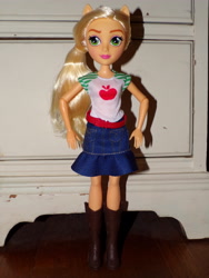 Size: 3456x4608 | Tagged: safe, derpibooru import, applejack, equestria girls, g4, arms, belt, boots, clothes, collar, denim skirt, doll, eyeshadow, freckles, hand, happy, hatless, legs, lipstick, long hair, makeup, missing accessory, photo, ponytail, shadow, shirt, shoes, short sleeves, skirt, smiling, standing, t-shirt, toy, wall