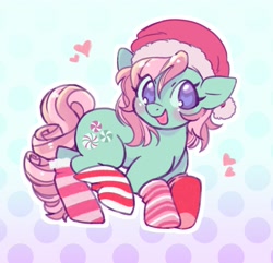 Size: 1627x1566 | Tagged: safe, artist:horseyuris, derpibooru import, minty, earth pony, pony, g3, blushing, cheeks, christmas, clothes, curly hair, curly mane, curly tail, cutie mark, gradient background, green coat, happy, hat, heart, holiday, looking at you, pink mane, polka dot background, purple eyes, santa hat, smiling, smiling at you, socks, solo, striped socks, tail