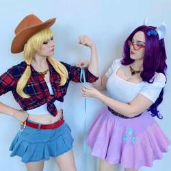 Size: 1080x1080 | Tagged: safe, derpibooru import, applejack, rarity, human, clothes, cosplay, costume, cowboy hat, cutie mark on clothes, duo, duo female, eyeshadow, female, glasses, hat, irl, irl human, kumoricon, makeup, measuring tape, photo