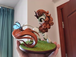 Size: 4624x3472 | Tagged: safe, artist:griffonleek, artist:tinybenz, derpibooru import, autumn blaze, butterfly, kirin, g4, blushing, butterfly on tail, craft, cute, female, figurine, golden eyes, hoof fluff, insect on tail, irl, leonine tail, multiple angles, open mouth, photo, picture, raised hoof, raised leg, smiling, solo, tail