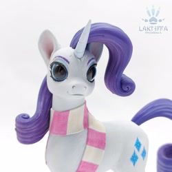 Size: 2560x2560 | Tagged: safe, alternate version, artist:lakterra, derpibooru import, rarity, pony, unicorn, g4, alternate angle, close-up, clothes, craft, female, figurine, horn, irl, looking at you, mare, photo, polymer clay, scarf, signature, simple background, solo, striped scarf, tail, white background