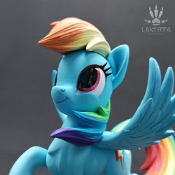 Size: 2560x2560 | Tagged: safe, artist:lakterra, derpibooru import, rainbow dash, pegasus, pony, g4, close-up, craft, female, figurine, irl, looking up, mare, photo, polymer clay, raised hoof, raised leg, signature, smiling, solo, spread wings, tail, wings