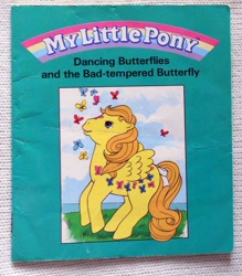 Size: 526x600 | Tagged: safe, derpibooru import, dancing butterflies, butterfly, pegasus, pony, g1, book, book cover, bow, cover, dancing butterflies and the bad-tempered butterfly, female, mare, official, solo, tail, tail bow